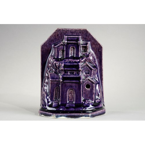 Sculpture porcelain aubergine color probably paperweight in form of houses and rocks